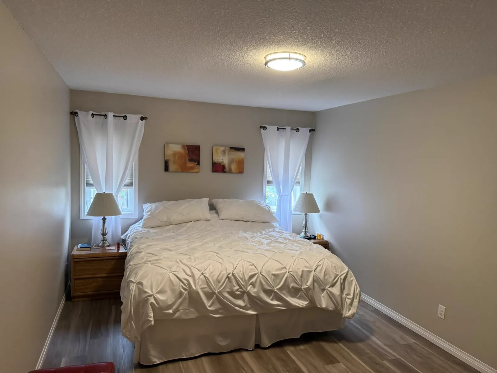 Bedroom with freshly painted walls in a soft neutral tone and clean ceiling lines
