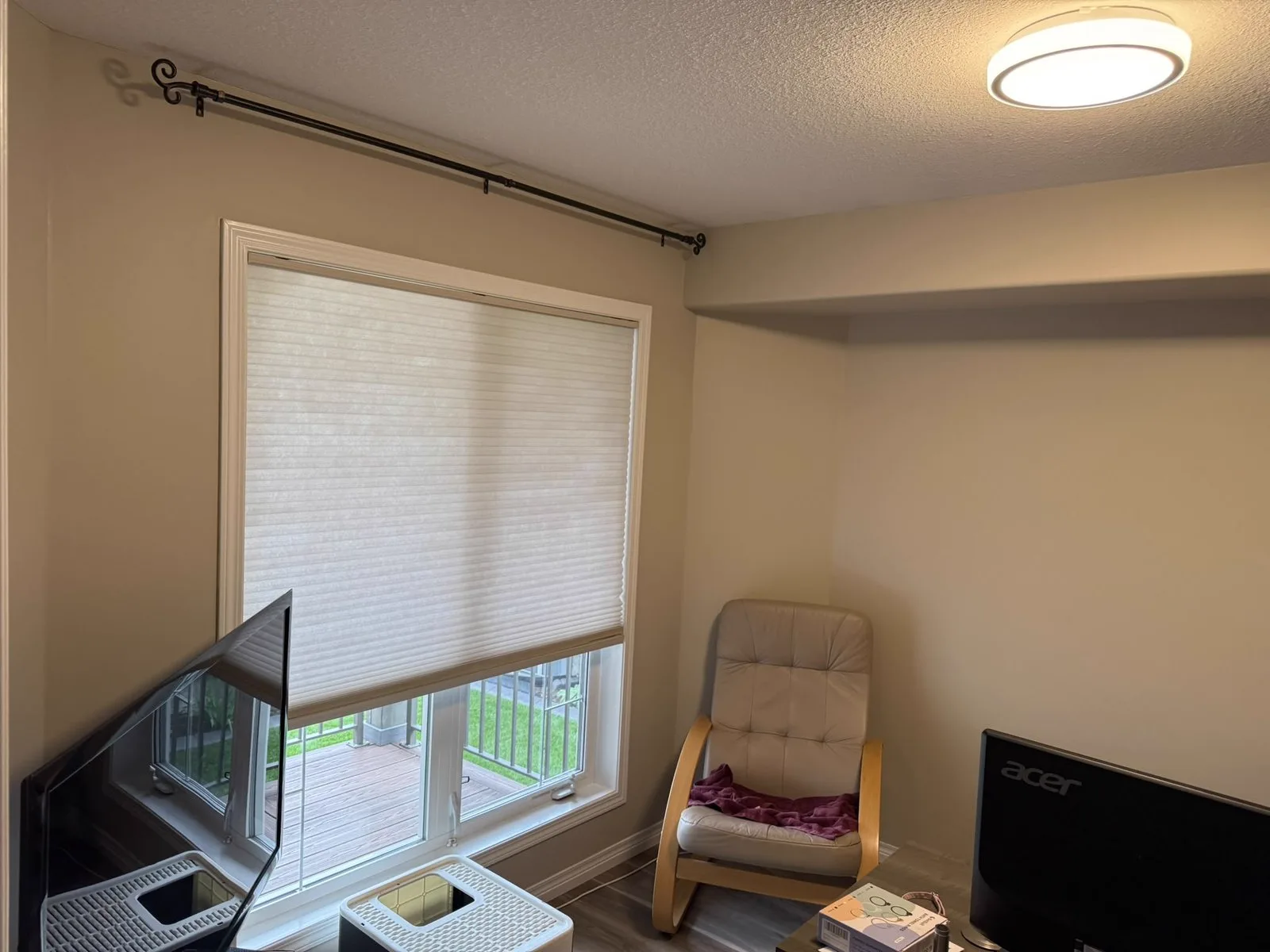 Bedroom corner with warm repainted walls and natural window light